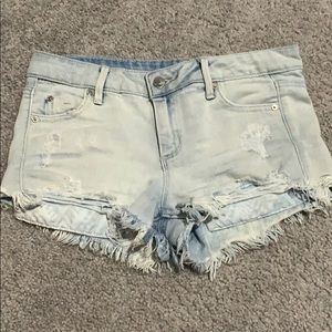 Acid wash cutoff ripped jean shorts